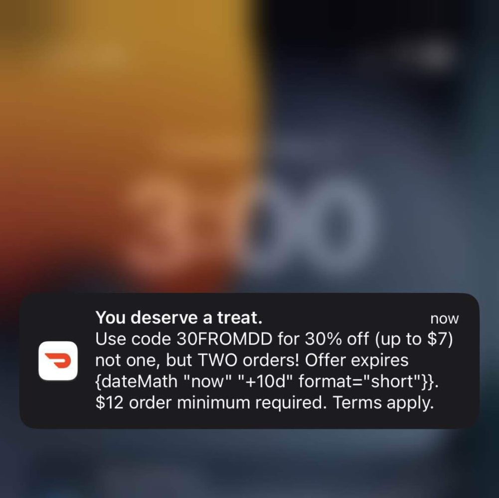 DoorDash sent a push notification with nonsense code. A Blind user joked that the error wouldn't have happened if DoorDash hadn't laid off so many employees earlier this year.